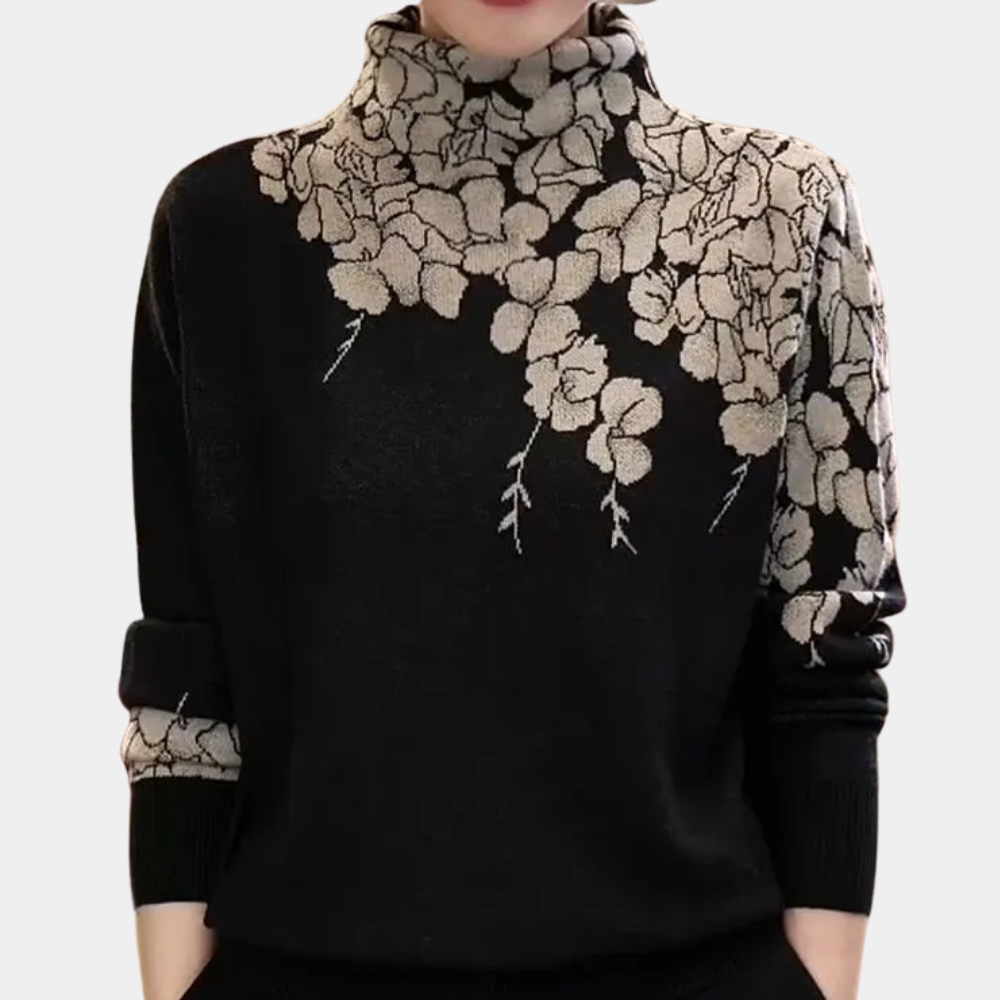 Zwarte damestrui met hoge kraag en beige bloemenpatroon, lange mouwen, modieuze herfst- en winterkleding, elegant en stijlvol design.